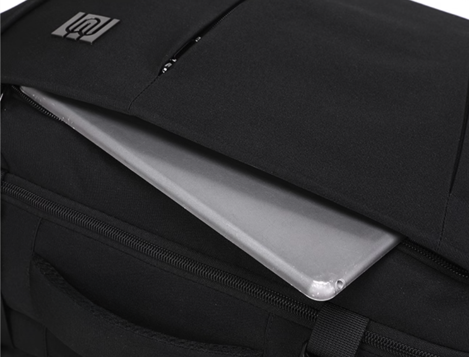 Black laptop bag with a clear compartment showing a laptop inside, brand logo visible.